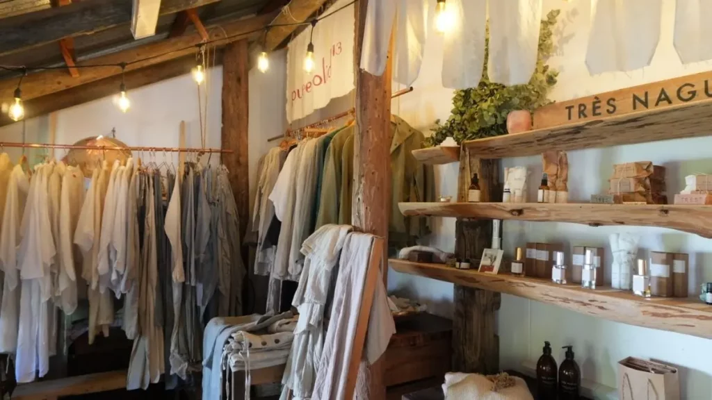 cotton and linen clothing hanging in a store