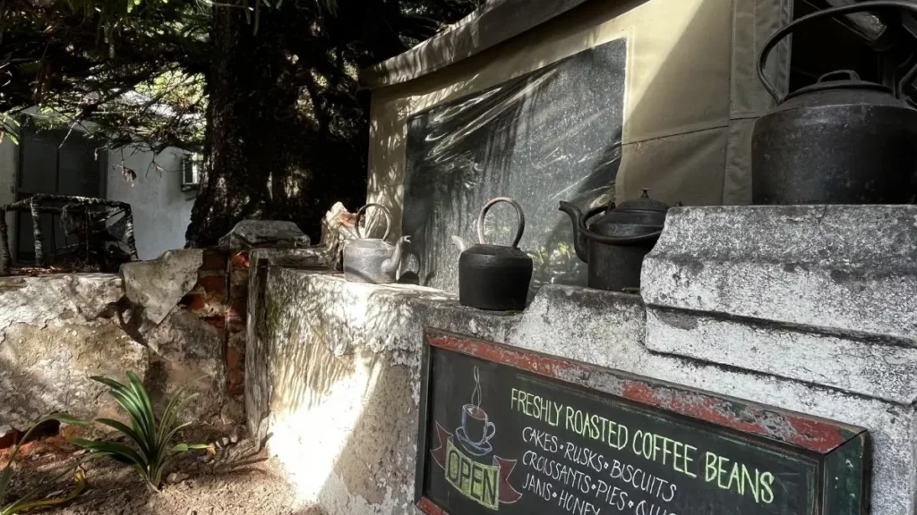 old kettles on a wall at the coffee shop